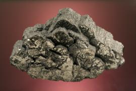 Bournonite, Machacamarca Mine, Potosi, Bolivia. One of the world’s largest crystals of Bournonite. Donor: M. Weill. Specimen 17 cm wide. Photo by G. Robinson. (DM 26891)