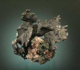 Copper, Franklin Mine, Houghton County, Michigan. Superb flat aggregates of black, tenorite coated copper crystals on matrix with small copper included calcite crystals. From the collection of J. T. Reeder. Specimen 11 cm wide. Photo by G. Robinson. (JTR 660)