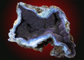 Azurite, Bisbee, Arizona. Velvety azurite filling a cavity in altered copper ore. Specimen 10 cm wide. Photo by C. Stefano. (UM11788)