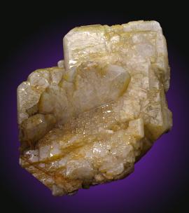 Barite, Cheshire, Connecticut. Large, lustrous barite crystals with a slight iridescence from the first barite mine in the U.S.A. beginning production in 1838. Specimen 12 cm tall. Photo by C. Stefano. (UM5056)