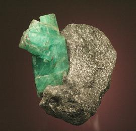 Beryl variety emerald, Ural Mts. Malyshevo, Russia. The Urals are one of the most important historical localities for emeralds. Donor: A. and C. Meieran. Specimen 9 cm tall. Photo by G. Robinson. (DM 24331) 