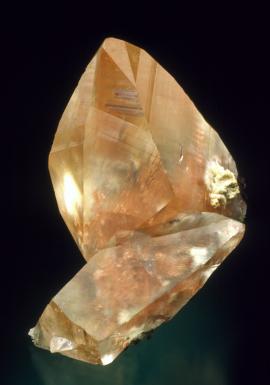 Calcite with native copper inclusions, Quincy Mine, Houghton County, Michigan. A superb example of copper included calcite. Donor: D. Gabriel. Specimen 5 cm tall. Photo by J. Scovil. (DCG 1159)