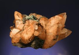 Calcite with native copper inclusions, Quincy Mine, Houghton County, Michigan. The iconic “Whittle Calcite” is one of the finest large copper included calcite specimens. Donor: T. Whittle. Sepcimen 22 cm wide. Photo by G. Robinson. (TW 1)