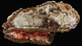 Calcite, copper, and cuprite, Bisbee, Arizona. An exceptional early specimen with old dealer price label. Specimen 13.4 cm wide. Photo by C. Stefano. (UM1764)