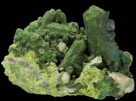 Bayldonite over mimetite with malachite after azurite, Tsumeb, Namibia. An early Tsumeb specimen from the first oxidation. Specimen 6.8 across. Photo by C. Stefano. (UM8189)