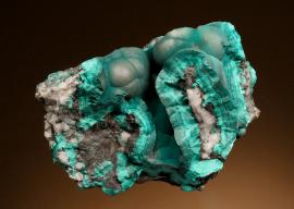 Pseudomalachite, Virneberg Mine, Rhineland-Pfalz, Germany. Pseudomalachite is a rare phosphate of copper named for its resemblance to much more common malachite. Donor: L. Hubbard. Specimen 7.5 cm wide. Photo by G. Robinson. (DM 12076)