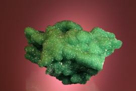Smithsonite, Tsumeb, Namibia. Green cuprian smithsonite from one of the world’s premier mineral localities. Donor: E. Heinrich. Specimen 10 cm long. Photo by C. Stefano. (EWH 1740)