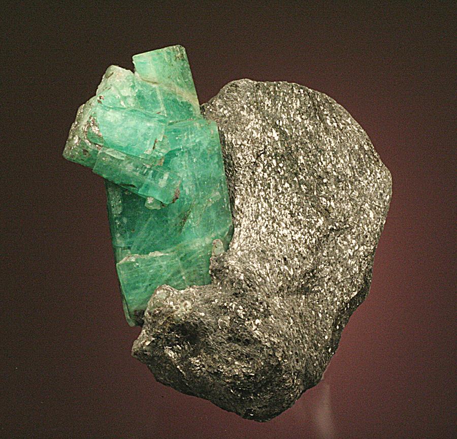 Beryl variety emerald, Ural Mts. Malyshevo, Russia. The Urals are one of the most important historical localities for emeralds. Donor: A. and C. Meieran. Specimen 9 cm tall. Photo by G. Robinson. (DM 24331) 