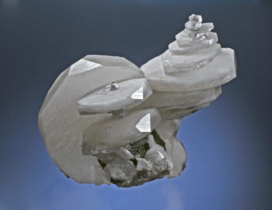 Calcite, San Sebastion Mine, Charcas, San Luis Potosi, Mexico. Among the finest known examples of “poker chip” calcite crystals. Donor: D. Gabriel. Specimen 18.5 cm wide. Photo by G. Robinson. (DCG 2255)
