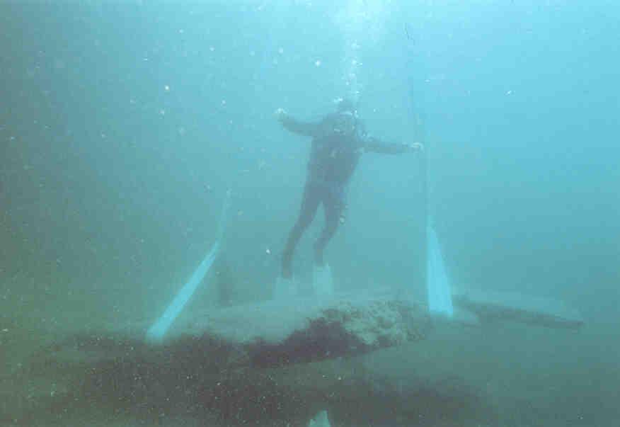 The 19-ton Lake Copper in process of being lifted out of Lake Superior with diver Bob Barron.