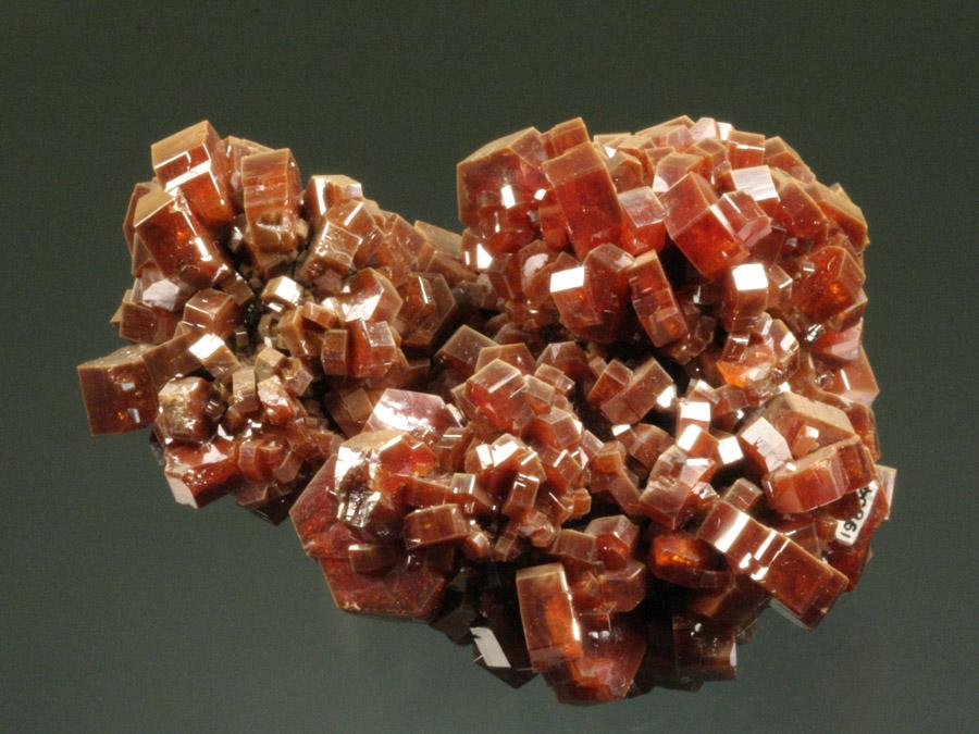 Vanadinite, ACF Mine, Mibladen, Morocco. Sharp orange vanadinite crystals from the world’s premier locality for the species. Specimen 6 cm wide. Photo by G. Robinson. (DM 19804)